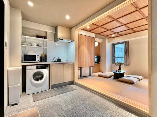 a laundry room with a washer and dryer at LANG HOTEL Ueno # free Breakfast in Tokyo