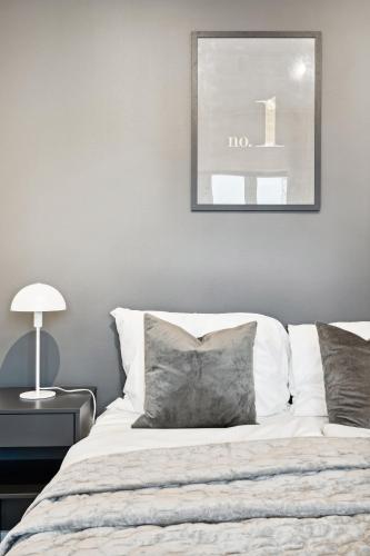 Ένα ή περισσότερα κρεβάτια σε δωμάτιο στο TotalApartments Vervet Gjøa