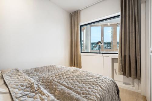Ένα ή περισσότερα κρεβάτια σε δωμάτιο στο TotalApartments Vervet Gjøa