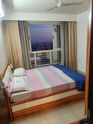 Postel nebo postele na pokoji v ubytování Royal Nest 3BHK Suites