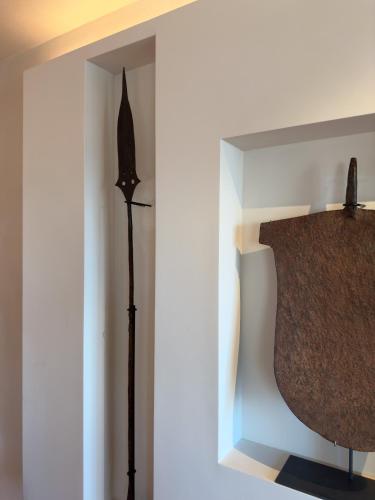 a room with a statue in a corner of a wall at Hotel Palazzo Durazzo Suites in Genova