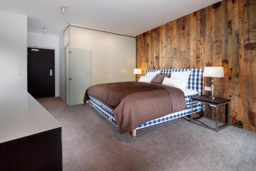 Una cama o camas en una habitación de Hotel Bedriska Wellness Resort & Spa