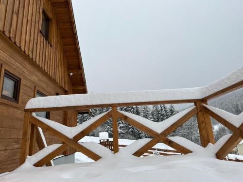 a winter view from the deck of a cabin at Drevenica RELAX in Makov