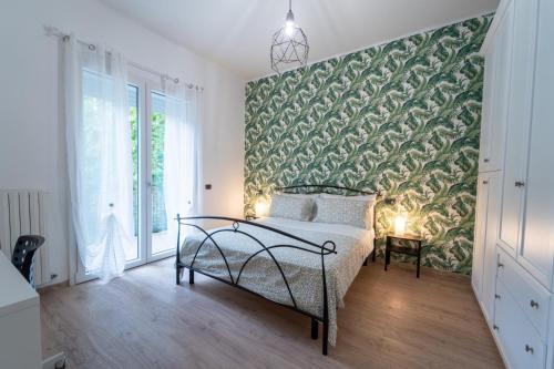 Giường trong phòng chung tại Art Gallery Rimini Apartments 130mq Esclusivo