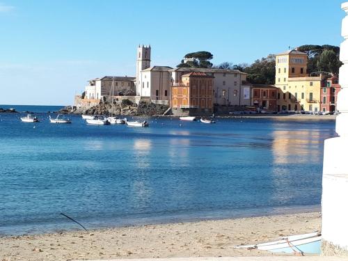 a view of a beach with boats in the water at Casa di Ermes in Sestri Levante