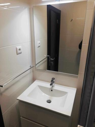 a bathroom with a sink and a mirror at Casa de São Miguel in Mirandela