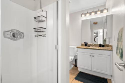 a white bathroom with a sink and a toilet at Ocean View Luxurious Retreat Full 3Bedroom Marina in Los Angeles