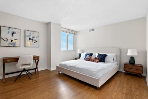 a white bedroom with a bed and a desk at Ocean View Luxurious Retreat Full 3Bedroom Marina in Los Angeles