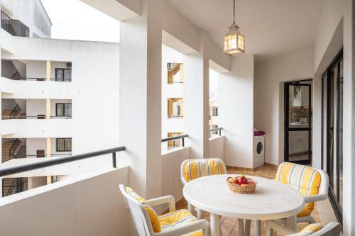 a small dining room with a table and chairs at Great, Bright 2-bedroom Flat in the Center of Vilamoura -Topázio By Centralgarve in Vilamoura