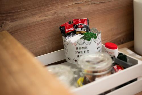 a drawer with a box of food and other items at Apartment Primula in Subotica