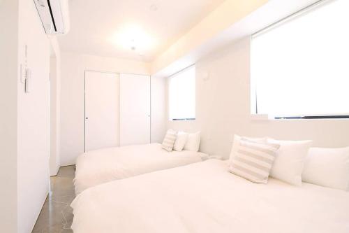 Ένα ή περισσότερα κρεβάτια σε δωμάτιο στο bHOTEL Komachi - BREAKFAST Included - Central Stay