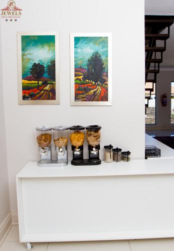 a white counter with some food items on it at JFT Jewels Guest House in East London