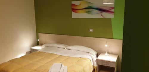 Postel nebo postele na pokoji v ubytování B&B Al Centro