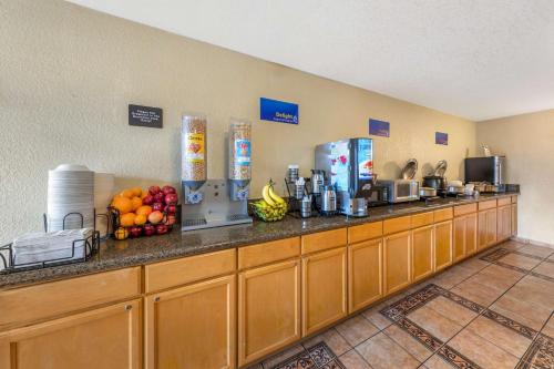 a kitchen with a counter with fruit on it at Best Western Americana Inn in San Ysidro, San Diego