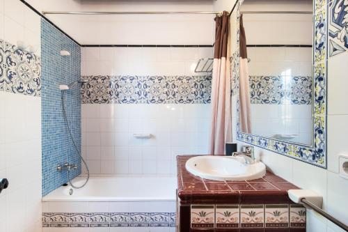a bathroom with a sink and a shower at Finca Pollentia in Alcudia