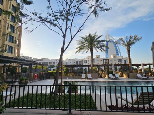 a resort with a pool and a building at Retreat near Burj Al Arab in Dubai