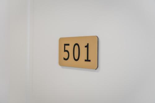 a digital clock on a wall displaying the time at Relax Inn Hotel Durres in Durrës