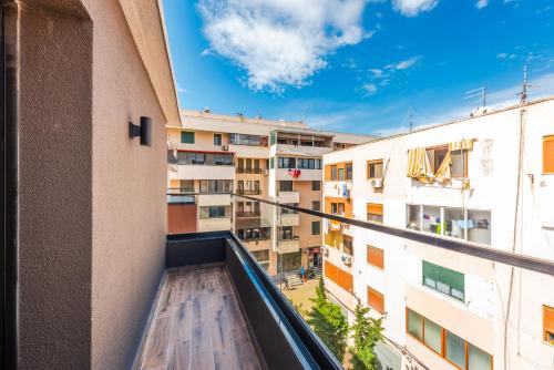 a balcony with a view of a building at Relax Inn Hotel Durres in Durrës