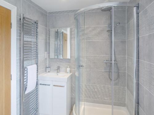 a bathroom with a shower and a sink at 5 Bed in Tealby 78678 in Tealby