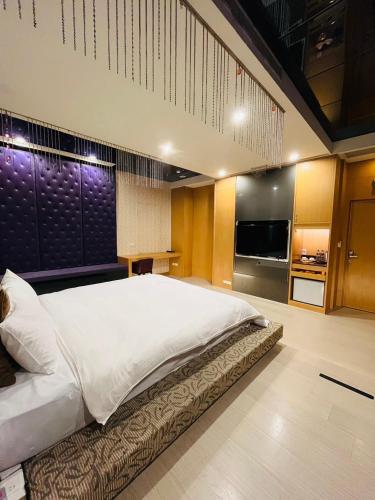 Postel nebo postele na pokoji v ubytování Walker Hotel - Chengde