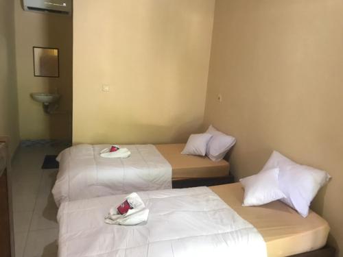 Llit o llits en una habitació de Kampung homestay