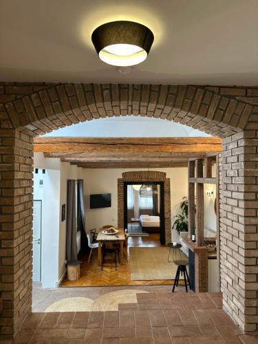 a living room with a brick wall and a ceiling at Marvellous Cozy Villa in Old Center Town Brasov in Braşov