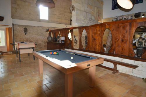 a large room with a pool table in it at Cinégîte du jardin aux étoiles - Proche de Saint Emilion in Saint-Pey-de-Castets