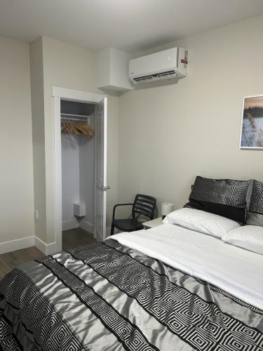 a bedroom with a bed and a air conditioner at Docker in Timberlea