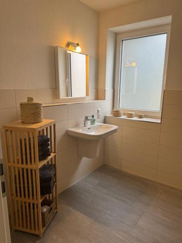 Phòng tắm tại Strandallee Ferienwohnungen