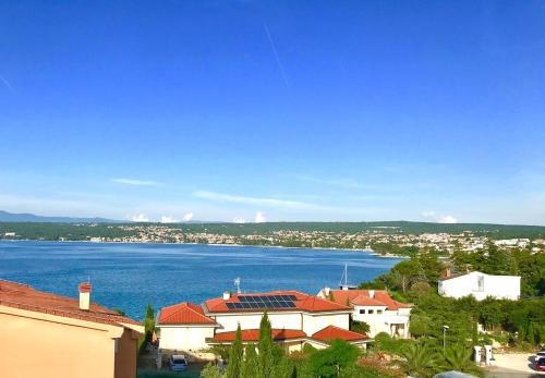 a view of a city and a large body of water at SeaBreeze in Porat