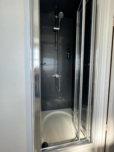 a shower in a bathroom with a glass door at Duke of Buckingham in Portsmouth