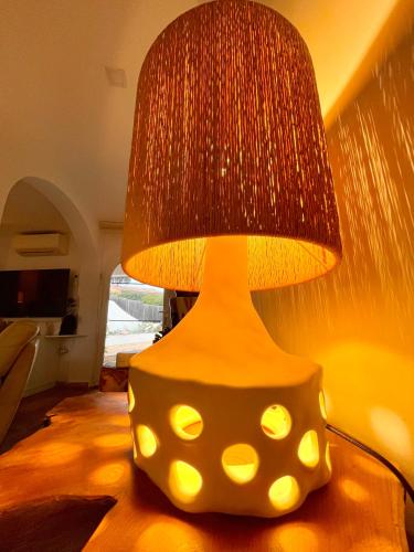 a lamp with a polka dot shade on a table at Villa provençale Golfe St Tropez climatisée piscine chauffée, Spa, billard, Wifi haut débit pro in Gassin