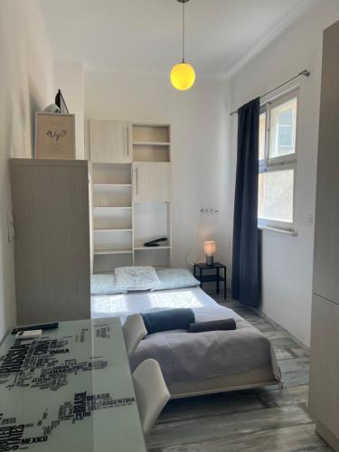 a bedroom with two beds and a table at BEM by Small Home Budapest in Budapest