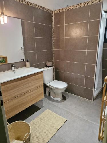 a bathroom with a toilet and a sink at Casarella Alzia in Santa-Reparata-di-Balagna