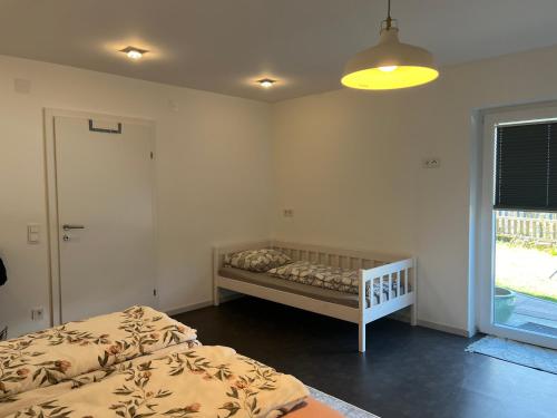 Кровать или кровати в номере Apartment Bergliebe