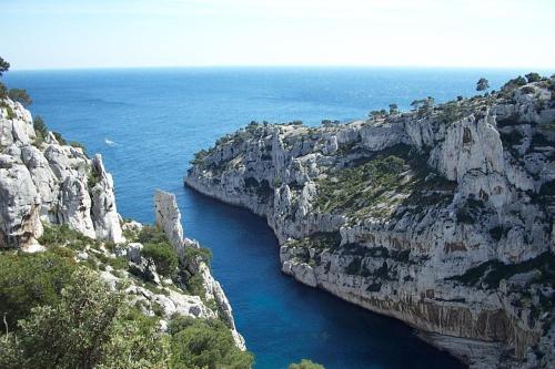 a view of a large canyon in the ocean at Les Jardins de Cassis - Parking Gratuit & Piscine Chauffée in Cassis