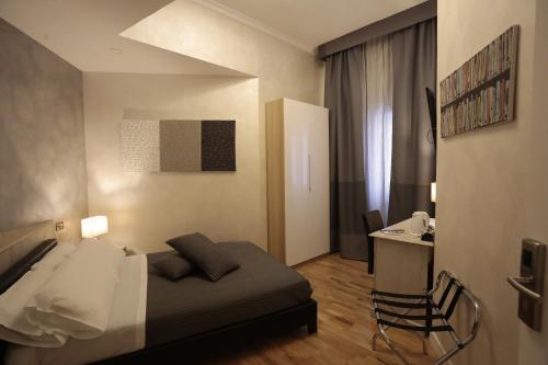 Cama o camas de una habitación en Attico Volta B&B