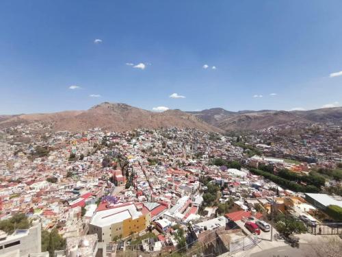 an aerial view of a city with mountains in the background at La Vista in Guanajuato
