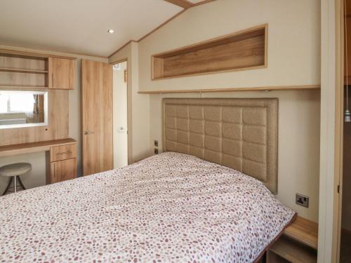 a bedroom with a bed in a room at A La Mer in Paignton