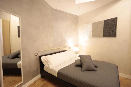 Postel nebo postele na pokoji v ubytování Attico Volta B&B