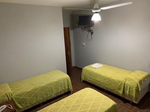 Postel nebo postele na pokoji v ubytování Hotel Nuevo Trento