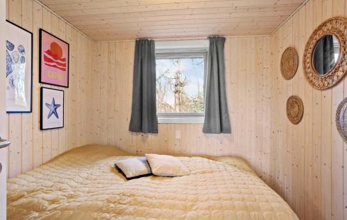 a bedroom with a bed with two pillows on it at Nice Home In Humble With Kitchen in Humble