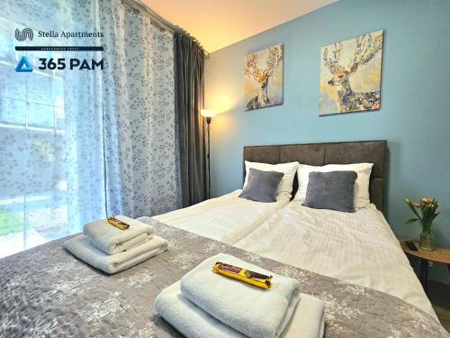 En eller flere senge i et værelse på Przytulny Apartament z Ogrodem - 365PAM