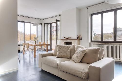a white living room with a couch and a table at Balilla30 - Spacious 2 BR APT next to city center in Milan