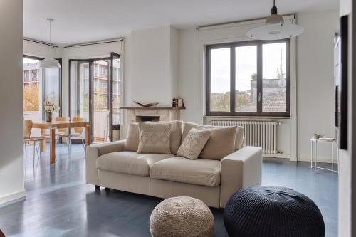 a living room with a couch and a table at Balilla30 - Spacious 2 BR APT next to city center in Milan