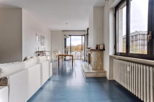a living room with a couch and a table at Balilla30 - Spacious 2 BR APT next to city center in Milan