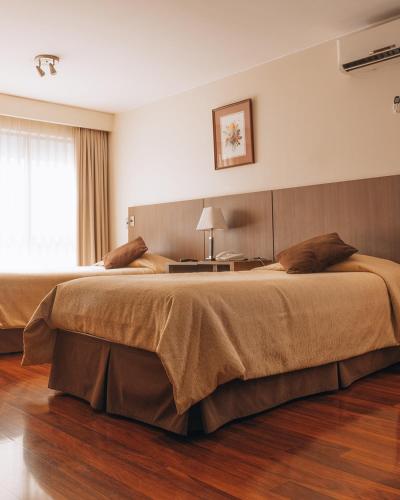 Ein Bett oder Betten in einem Zimmer der Unterkunft Hotel Diego de Velazquez