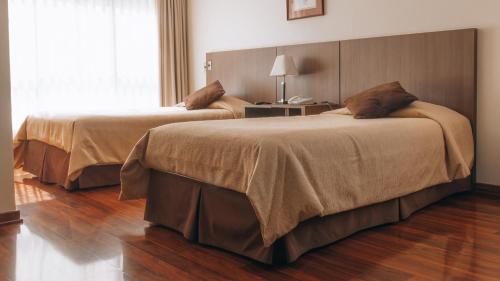 Ein Bett oder Betten in einem Zimmer der Unterkunft Hotel Diego de Velazquez