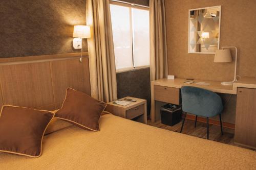 Ein Bett oder Betten in einem Zimmer der Unterkunft Hotel Diego de Velazquez
