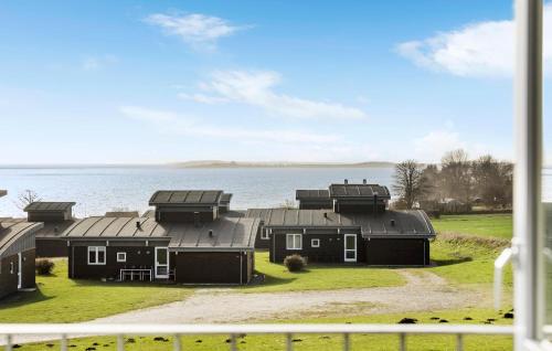 a view from a window of a house next to the water at Holiday Home Mosegården Faaborg Denm in Fåborg